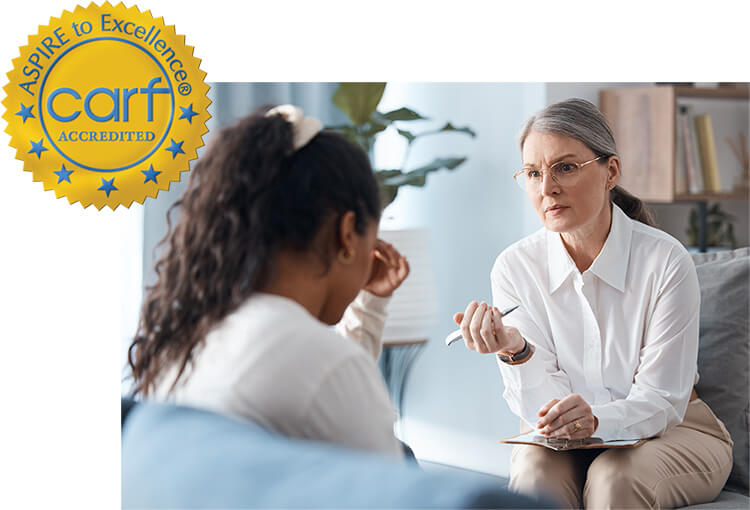 Doctor with patient and CARF logo attached